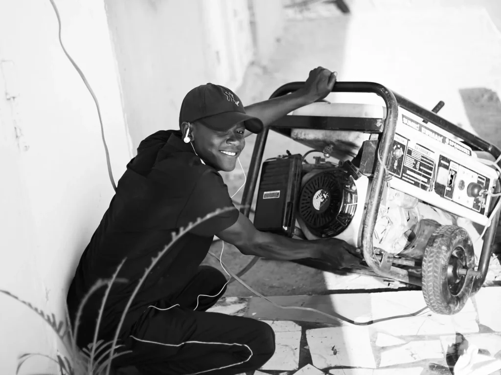 Man operating a portable generator outdoors