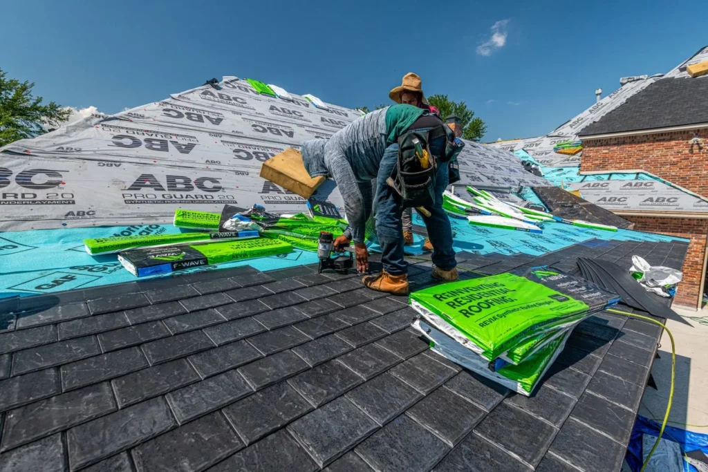 Roofing crew installing a new roof on a brick home in Fort Worth, one of the Texas trades we serve