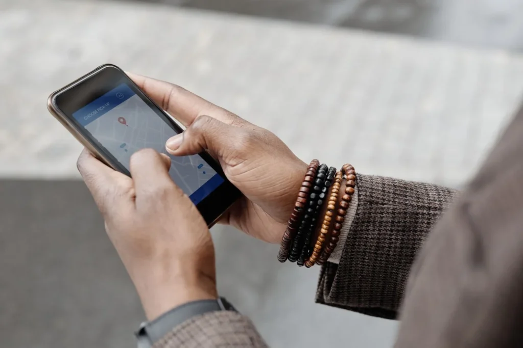 Local SEO for contractors: person using a map app on a smartphone outdoors