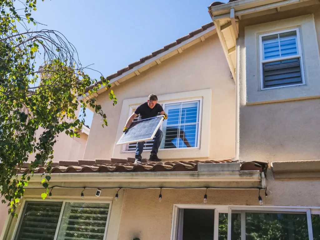 Solar marketing in Texas: technician installing solar panels on a home roof