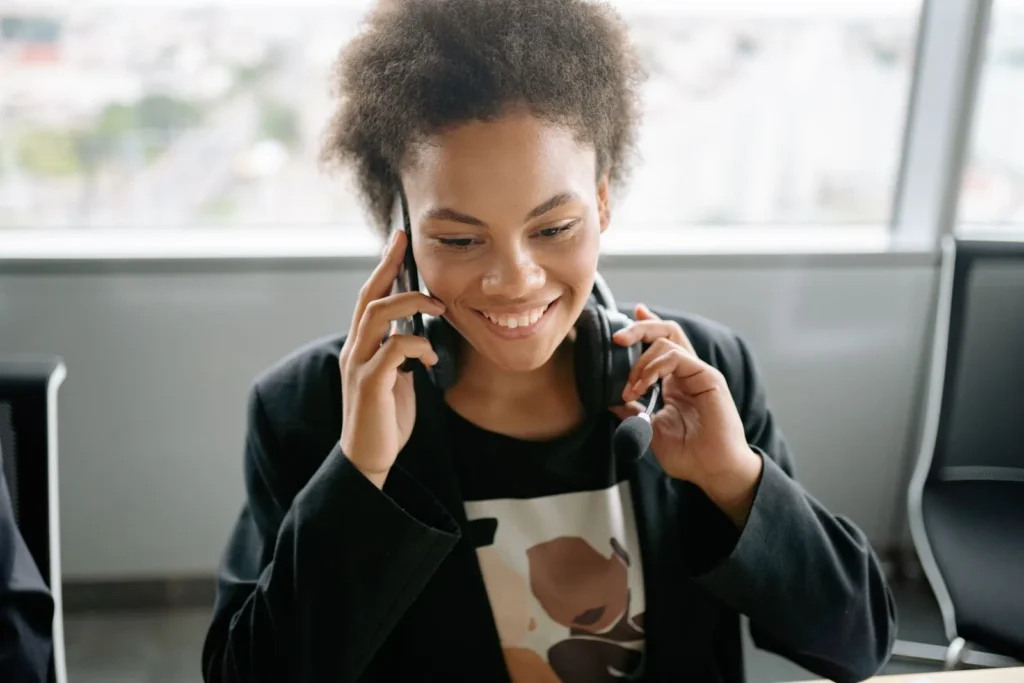Smiling woman talking on a phone